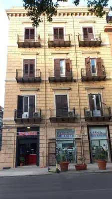 a room with white shelves on the wall at CORNER ROME appartamento in Palermo