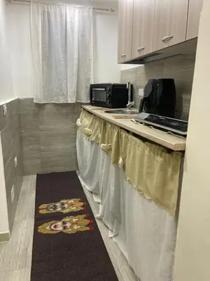 a kitchen with a counter with a sink and a towel at A un passo dalla cattedrale in Palermo