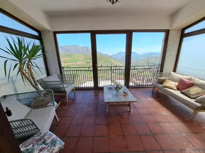 a living room with couches and a view of mountains at Villa Paola appartamento completo in Ciminna