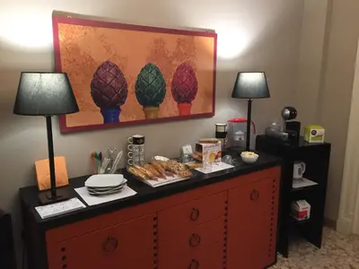 a table with food on it with two lamps at Due Cani Apartment in Palermo