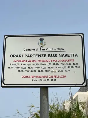 a street sign for an open participation bus marker at A Cantunera in San Vito lo Capo