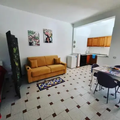 a living room with a couch and a table at casaafauka in Carini