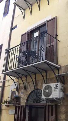 a balcony on the side of a building at Casina al 32 in Palermo