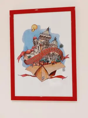 a picture of a painting of a building on a sign at Un Passo dal Porto in Palermo