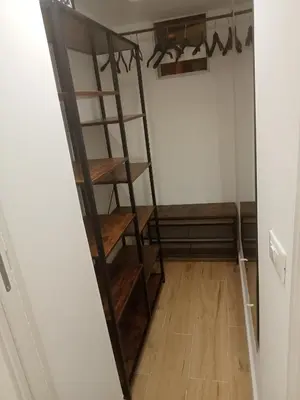 a room with a wooden ladder in a room at La Casetta delle Strelizie in Palermo