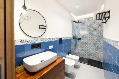 a bathroom with a sink and a toilet and a shower at Mondello 2C casa vacanze in Palermo