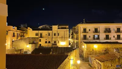 a view of a city at night with buildings at Shallah Apartment nel cuore del centro storico di Palermo in Palermo