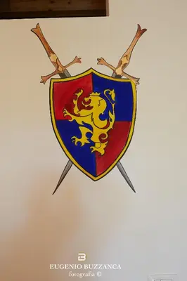 a shield with a dragon on it on a wall at La Casa Dei Cavalieri in Caccamo