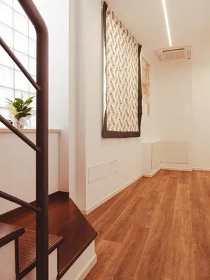 an empty room with a staircase and a window at U Zuccareddu in Alcamo