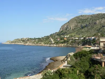 a view of a beach with houses on a hill at Calipso in Bagheria