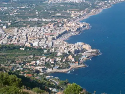 an aerial view of a city next to the ocean at Calipso in Bagheria