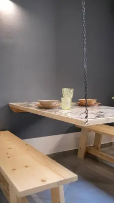 a wooden table with a chain on top of it at Le Radici casa vacanze in Palermo