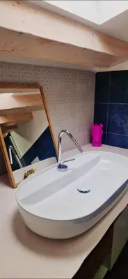 a white sink in a kitchen with a shelf at 2 Sicilie Rooms and Suite in Centro in Palermo