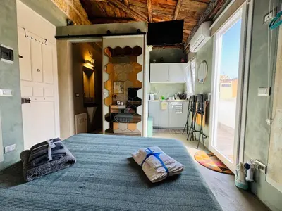 a bedroom with a bed with two towels on it at A Nicuzza in Palermo