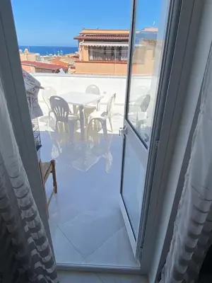 a view of a patio with a table and chairs at Casa vacanza solemare in Balestrate