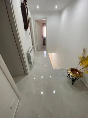 a hallway with a room with a table on the floor at Casa vacanza solemare in Balestrate