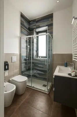 a bathroom with a shower and a toilet and a sink at Marine Case Vacanze in Palermo