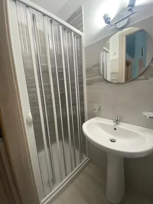 a bathroom with a sink and a mirror at La casetta del sole in Castellammare del Golfo