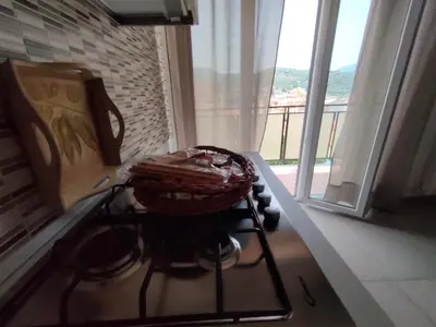 a basket sitting on top of a stove in a kitchen at GiErre Apartment in Termini Imerese
