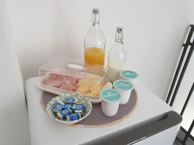 a tray with food and bottles on a table at Villa Bona in Termini Imerese