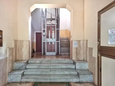 a staircase in a building with a glass door at Annacati House Centro Storico in Palermo