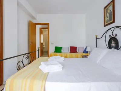 a bedroom with two beds with white sheets at Apartment Giardini Gaia by Interhome in San Vito lo Capo