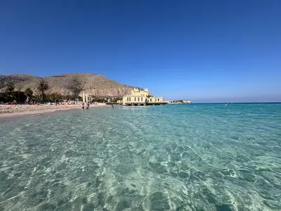 a view of a beach from the water at MONDELLO COTTAGE in Mondello
