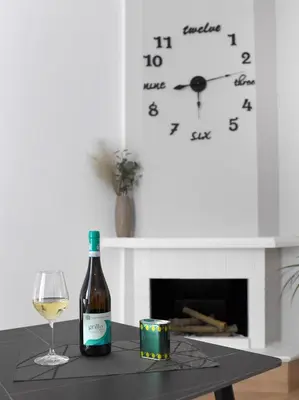 a bottle of wine and a glass on a table at A CANTUNERA in Balestrate