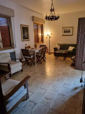a bedroom with a bed and a checkered floor at Blu horizon in Campofelice di Roccella