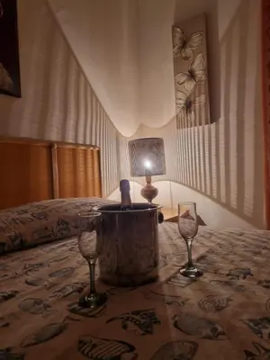 a living room with a couch and a table at Blu horizon in Campofelice di Roccella