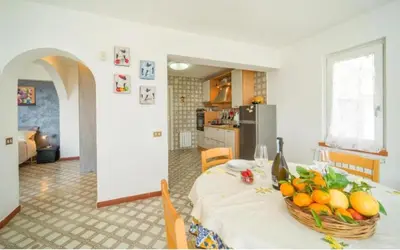 a kitchen with a table with a basket of fruit on it at La Conca D'Oro in Palermo