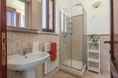 a bathroom with a sink and a shower at The Terrace Behind the Cathedral by Wonderful Italy in Palermo