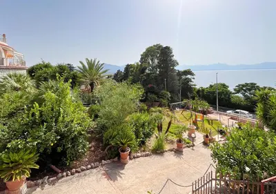a garden with trees and plants and a playground at Solemar Sicilia - Villa Elis in Bagheria