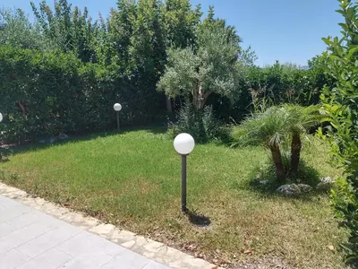 two golf balls on a pole in the grass at Casa Vacanze Villa Pomelia in Campofelice di Roccella