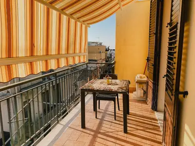 a balcony with a table on top of a balcony at Casa Vacanza Stella Maris in Isola delle Femmine