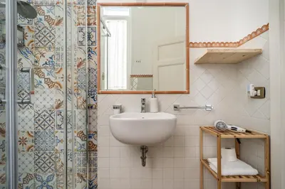 a bathroom with a sink and a shower at [La Maiolica] - Centro storico in Palermo