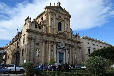 an old building with people standing in front of it at Sunny Home in Palermo