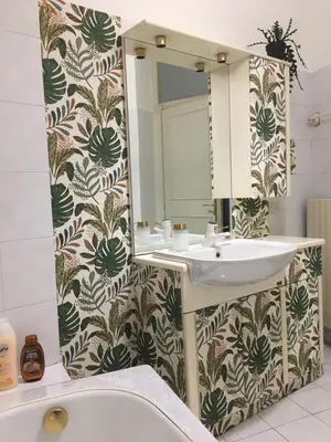 a bathroom with a sink and a mirror at La casa di Nanà in centro in Palermo