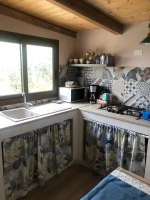 a kitchen with a sink and a stove at Lovely Country House in Trappeto