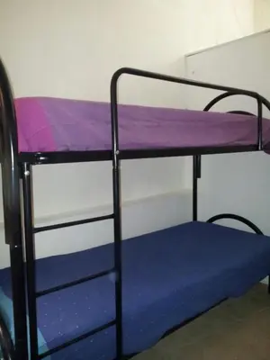a bunk bed in a room with a purple mattress at Casa Vacanza Terrazza sul Mare in Castellammare del Golfo