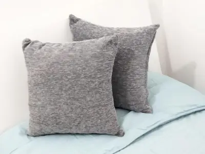 two pillows sitting on top of a bed at Finestra sul Mare di Alessandro in Balestrate