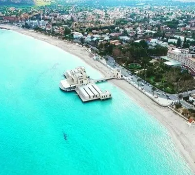 an aerial view of a beach with a pier at La casetta degli ulivi in Palermo