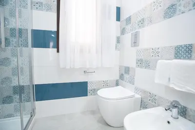 a bathroom with a toilet and a sink at La Chiostrina in Castellammare del Golfo