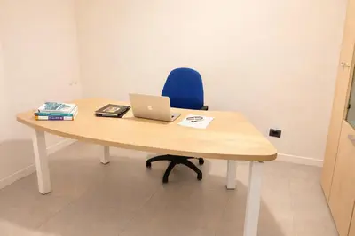 an office desk with a laptop computer on it at Giardino Lussemburgo, Elegante e confortevole appartamento tra Mondello e il centro storico di Palermo in Palermo