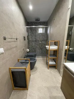 a bathroom with two sinks and a tub and two toilets at Casa vacanze Soraja in Palermo