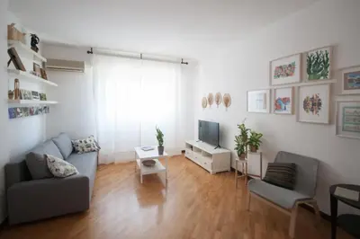a living room with a couch and a tv at Casa Sul Mare Seaside apt in front of the sea in Palermo
