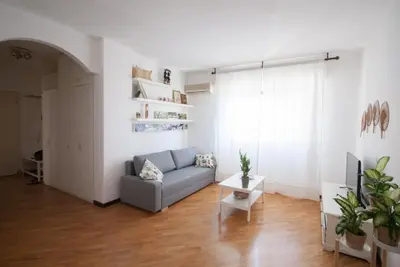 a living room with a couch and a table at Casa Sul Mare Seaside apt in front of the sea in Palermo