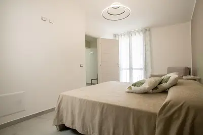 a bedroom with a bed with two pillows on it at La Chiostrina 2 in Castellammare del Golfo