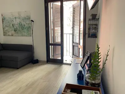 a living room with a couch and a table at Casa Giura in Palermo