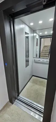 a sliding glass door in a room with a staircase at Casa Giura in Palermo